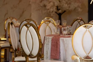 Elegant wedding reception buffet featuring appetizers, main courses and desserts inside a decorated banquet hall.